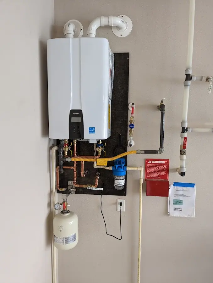 Professional plumber installing copper piping in a Hawthorne home